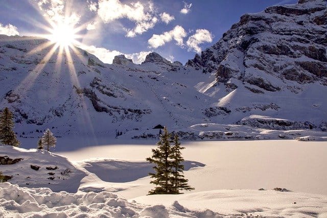 Sunrise on Imbolc over snow covered mountain